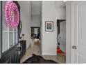 Inviting entryway featuring an elongated foyer, high ceilings, and stylish decor at 752 Hobonny Loop, Longs, SC 29568