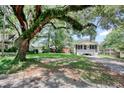 Adorable single-story home surrounded by mature trees and lush landscaping at 1028 Duke St., Georgetown, SC 29440