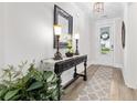Elegant entryway with decorative table, stylish lamps, and a patterned rug at 117 Black Water Dr., Murrells Inlet, SC 29576