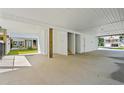 Spacious carport featuring white ceiling and beams offering ample space and functionality at 1718 26Th Ave. N, North Myrtle Beach, SC 29582