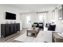 Cozy living room featuring modern decor, stylish furniture, and lots of natural light at 2828 Rowyn St., Longs, SC 29568