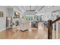 Bright living room with hardwood floors, fireplace, and large windows at 3005 Purity Place Loop, Murrells Inlet, SC 29576