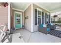 Inviting front porch with comfortable seating and stylish decor at 3005 Purity Place Loop, Murrells Inlet, SC 29576