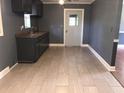 Kitchen featuring tile floors, gray walls and cabinets with sink at 3110 Pinewood Dr., Loris, SC 29569
