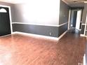 Spacious living room with hardwood flooring, neutral paint, and ample natural light at 3110 Pinewood Dr., Loris, SC 29569