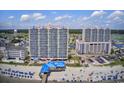 Aerial view of resort towers with beach access, pool, and beautiful waterfront setting at 3500 N Ocean Blvd. # 701 702, North Myrtle Beach, SC 29582
