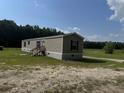 Charming single Gathering house showcasing modern siding and a well-maintained lawn at 364 Jamie Rd., Galivants Ferry, SC 29544