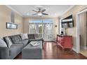 Cozy living room with plush seating, balcony access, and neutral decor, creating a relaxing atmosphere at 4387 Landing Rd., Little River, SC 29566