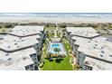 Beautiful aerial view of the condo complex with a sparkling pool and manicured grounds at 5601 N Ocean Blvd. # B-314, Myrtle Beach, SC 29577