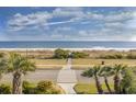 Stunning beach view from the property with palm trees, and well maintained path at 5601 N Ocean Blvd. # B-314, Myrtle Beach, SC 29577