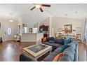 Bright living room featuring a ceiling fan, hardwood floors, comfortable seating and dining area at 716 Weston Dr., Conway, SC 29526