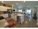 Open-concept kitchen featuring granite countertops, stainless steel appliances, and a large island at 8164 Forest Edge Dr., Myrtle Beach, SC 29579
