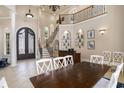 Elegant dining room with a staircase and bar in the background at 1503 Cadiz Dr., Myrtle Beach, SC 29579