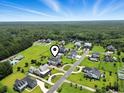Aerial view of luxury neighborhood and spacious property featuring verdant landscaping and picturesque setting at 157 Pottery Landing Dr., Conway, SC 29526