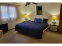 Cozy bedroom with ceiling fan, bedside lamps, and natural light from the window at 207 Double Eagle Dr. # E-1, Surfside Beach, SC 29575