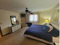Bright bedroom featuring neutral colors, ceiling fan, and matching dressers at 207 Double Eagle Dr. # E-1, Surfside Beach, SC 29575