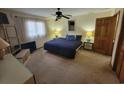Bedroom featuring neutral walls, ceiling fan, and a comfortable bed setting at 207 Double Eagle Dr. # E-1, Surfside Beach, SC 29575
