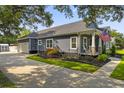 Exterior showcases a driveway leading to a two-car garage and a well-maintained yard at 2588 Long Avenue Ext., Conway, SC 29526