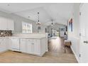 Open-concept space seamlessly connects kitchen and living area with modern flooring at 300 Kiskadee Loop # K, Conway, SC 29526