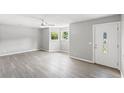Bright living room with neutral walls, lots of natural light, and stylish vinyl floors at 4249 E Highway 9, Loris, SC 29569