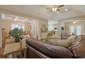 Bright and airy living room showcasing a seamless flow to the dining area and kitchen at 428 Arlington Circle, Murrells Inlet, SC 29576