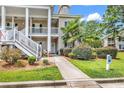Charming condo featuring a covered porch, well-maintained landscaping, and accessible entrance at 447 Mahogany Dr. # 102, Murrells Inlet, SC 29576