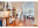 Spacious hallway with hardwood floors, elegant archways, and decorative accents at 492 Grand Cypress Way, Murrells Inlet, SC 29576