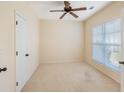 Cozy bedroom featuring a ceiling fan, bright window, and soft carpet at 56 Willowbend Dr., Murrells Inlet, SC 29576