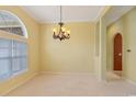 Bright living room with modern color scheme, large windows and carpeted floor at 56 Willowbend Dr., Murrells Inlet, SC 29576