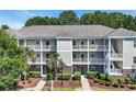 A multi-Gathering unit with balconies, nice landscaping, and brick accents at 6253 Catalina Dr. # 1824, North Myrtle Beach, SC 29582