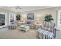 Bright living room featuring striped furniture, and many seaside decorations at 6253 Catalina Dr. # 1824, North Myrtle Beach, SC 29582