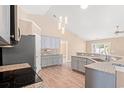 Well-lit kitchen boasts granite countertops, stainless steel appliances, and modern pendant lighting at 708 Alexis Dr., Longs, SC 29568