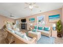 Inviting living room featuring wicker furniture, a decorative fireplace, and beach-themed artwork at 708 Alexis Dr., Longs, SC 29568