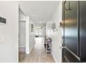 Inviting hallway with wood flooring and light walls leading to the living area at 821 Twickenham Loop, Longs, SC 29568