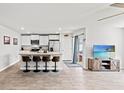 Bright kitchen with stainless steel appliances, island with bar seating, and modern decor at 821 Twickenham Loop, Longs, SC 29568