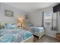 Cozy bedroom featuring two twin beds with matching coastal-themed bedding at 920 N Waccamaw Dr. # 2310, Murrells Inlet, SC 29576