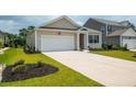 Well-maintained one story home featuring a driveway, a one car garage, and manicured lawn at 964 Irving Dr., Little River, SC 29566