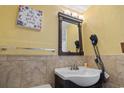 Traditional bathroom with earth-tone tile and decor at 1605 S Ocean Blvd. # 208, Myrtle Beach, SC 29577