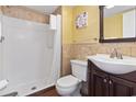 Cozy bathroom features wood-style tile and walk-in shower at 1605 S Ocean Blvd. # 208, Myrtle Beach, SC 29577
