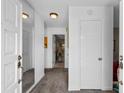 Inviting entryway with white doors, mirrored wall, carpeted floor and recessed lighting at 207 Green Lake Dr., Myrtle Beach, SC 29572