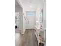 Bright entryway with wood floors, decor, and plenty of natural light, creating a warm and welcoming first impression at 2438 Polaris Path, Myrtle Beach, SC 29577