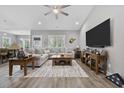 Spacious living area featuring a comfortable sectional sofa and a large flat-screen TV at 4446 Boggy Rd., Conway, SC 29526
