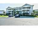 Condominium building with manicured landscaping and convenient parking at 5801 Oyster Catcher Dr. # 832, North Myrtle Beach, SC 29582