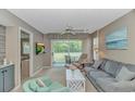 Cozy living room with a sliding glass door leading to a porch and comfortable seating area at 650 Tupelo Ln. # 5-F, Longs, SC 29568