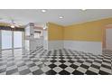 Bright living room featuring black and white checkered floors and archways to other rooms at 804 47Th Ave. N, Myrtle Beach, SC 29577