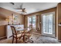 Cozy dining room featuring a glass table, white buffet, and large window with natural light at 808 Myrtle Ct. # 808, North Myrtle Beach, SC 29582
