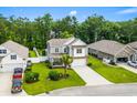 Aerial view of a well-maintained home with green lawn and fence in a suburban neighborhood at 1007 Oak Marsh Ln., North Myrtle Beach, SC 29582