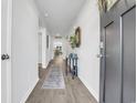 Inviting hallway with hardwood floors that leads into the living spaces at 113 Arbor Crest Ln., Tabor City, NC 28463