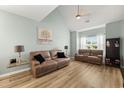 Spacious living room with vaulted ceilings, wood floors, and two comfortable leather couches at 120 River Country Dr., Conway, SC 29526
