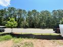 A quiet street with trees behind it at 1627 Sayebrook Pkwy., Myrtle Beach, SC 29588